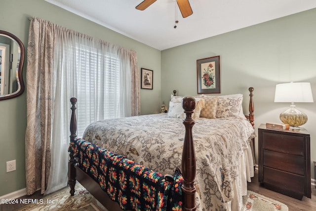 bedroom featuring ceiling fan and hardwood / wood-style flooring