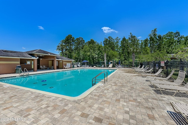 view of pool featuring a patio