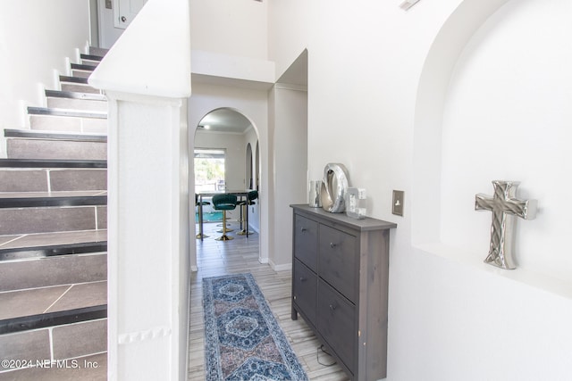 hallway with hardwood / wood-style floors