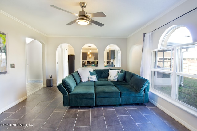 living room featuring crown molding and ceiling fan