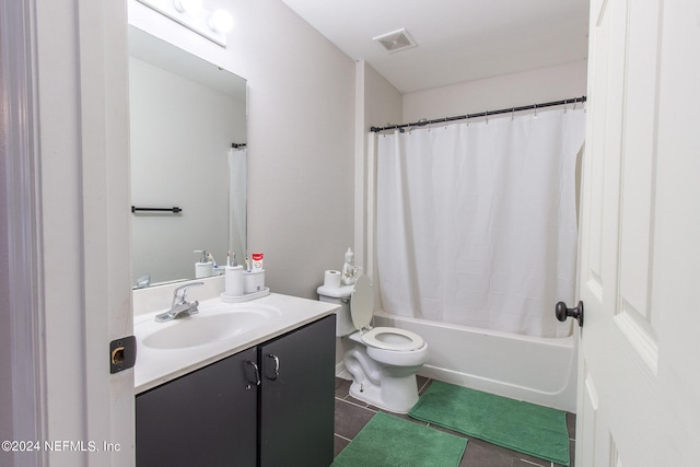 full bathroom with vanity, shower / bath combo, toilet, and tile patterned floors