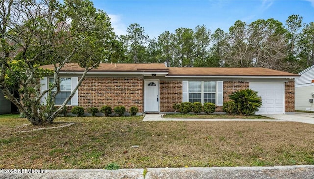 ranch-style house with a garage and a front lawn