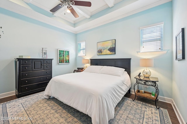 bedroom featuring coffered ceiling, beam ceiling, wood-type flooring, ornamental molding, and ceiling fan