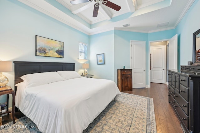 bedroom featuring coffered ceiling, beamed ceiling, crown molding, ceiling fan, and dark hardwood / wood-style flooring