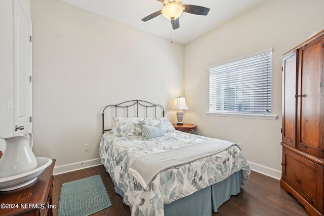 bedroom featuring ceiling fan and dark hardwood / wood-style flooring