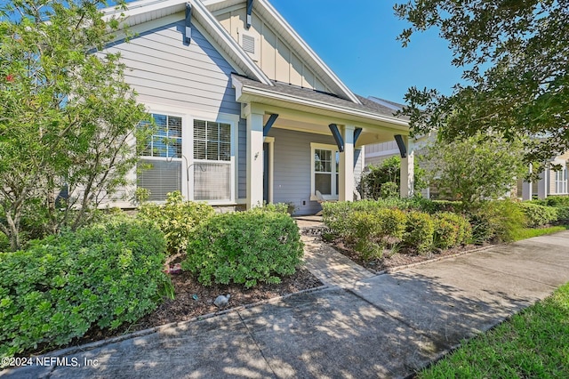 doorway to property featuring covered porch