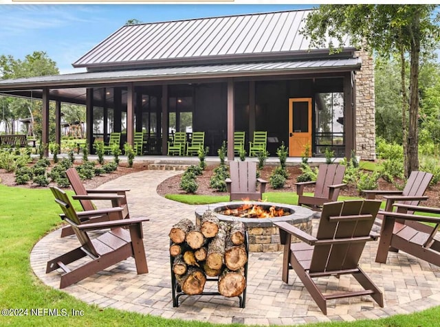 view of patio with a fire pit