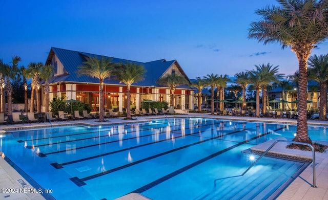 view of pool at dusk