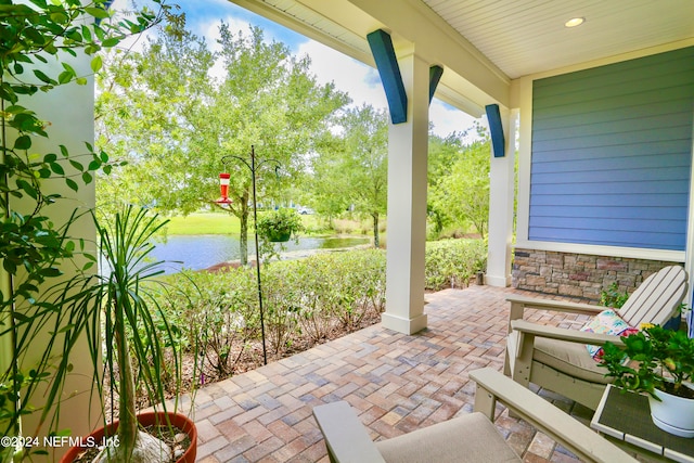 view of patio featuring a water view