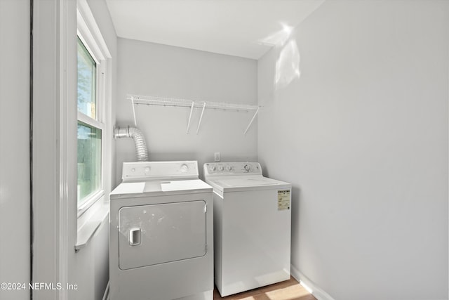 laundry room with washing machine and clothes dryer