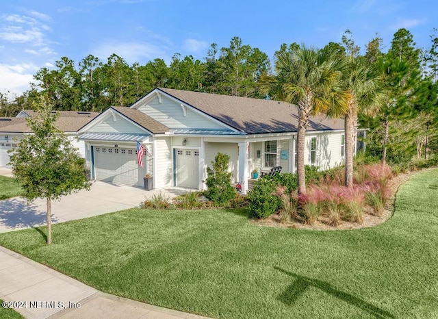 ranch-style house featuring a front lawn and a garage