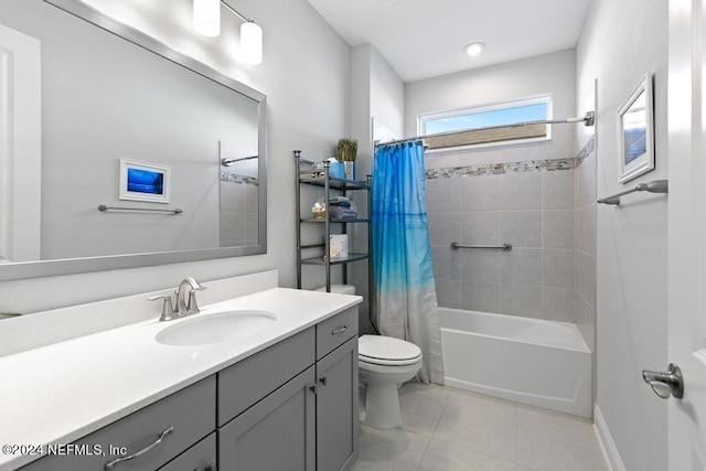 full bathroom featuring vanity, toilet, tile patterned floors, and shower / tub combo with curtain