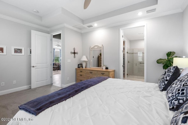 bedroom with ensuite bath, a raised ceiling, ceiling fan, crown molding, and light colored carpet