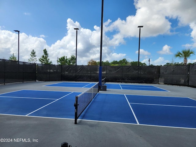 view of sport court featuring basketball hoop