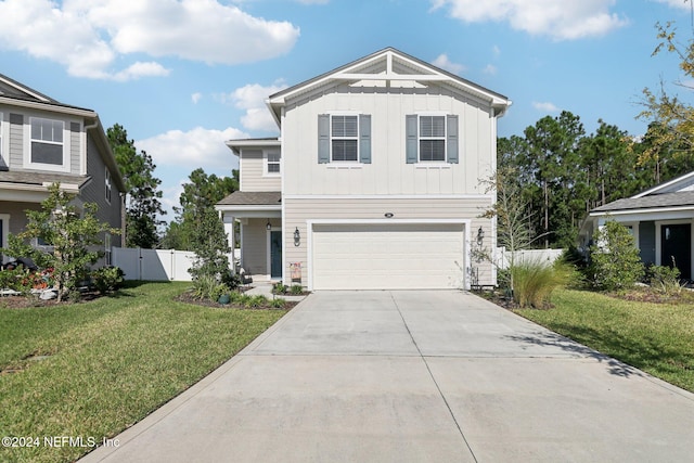 view of front of property featuring a garage and a front lawn