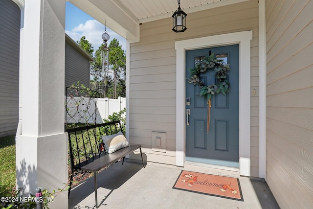 entrance to property featuring covered porch