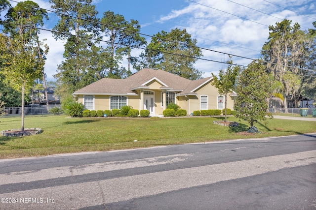 view of front of property with a front lawn