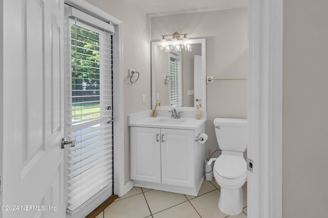 bathroom with vanity, toilet, and tile patterned floors