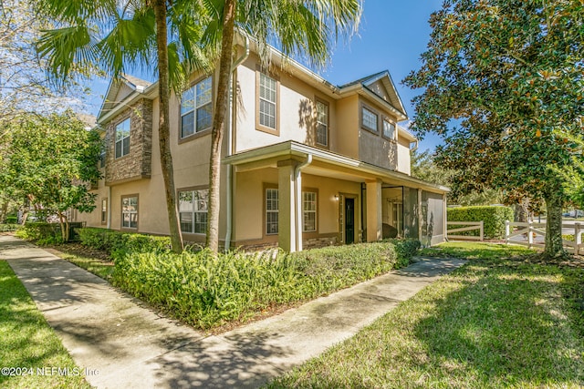 view of side of property with a yard