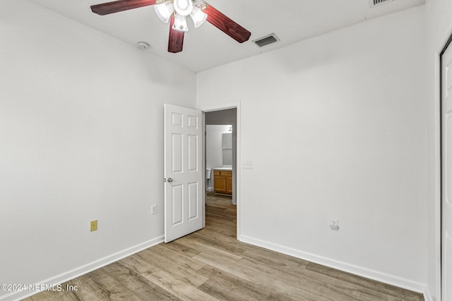 empty room featuring light hardwood / wood-style floors and ceiling fan