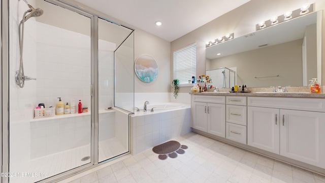 bathroom featuring vanity and plus walk in shower