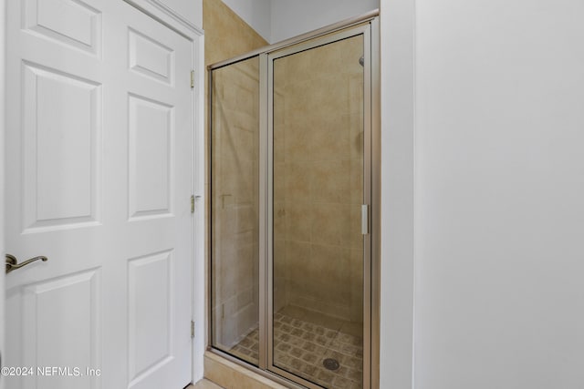 bathroom with an enclosed shower