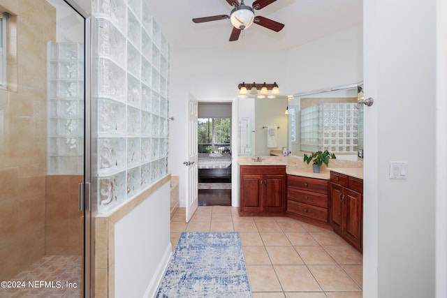 bathroom with vanity, ceiling fan, tile patterned floors, and walk in shower