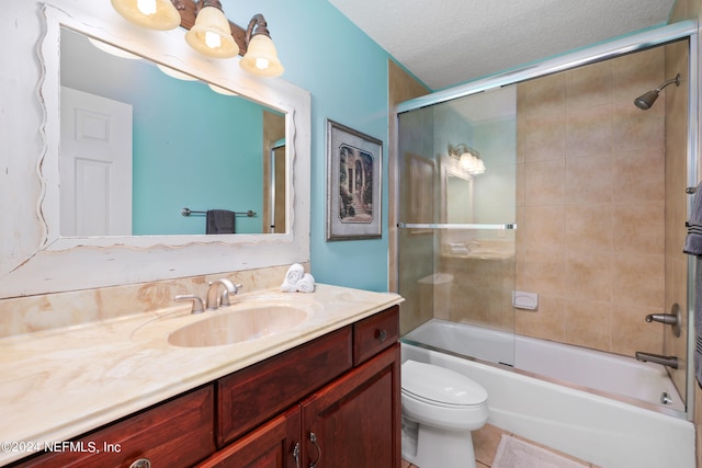 full bathroom featuring vanity, a textured ceiling, bath / shower combo with glass door, and toilet