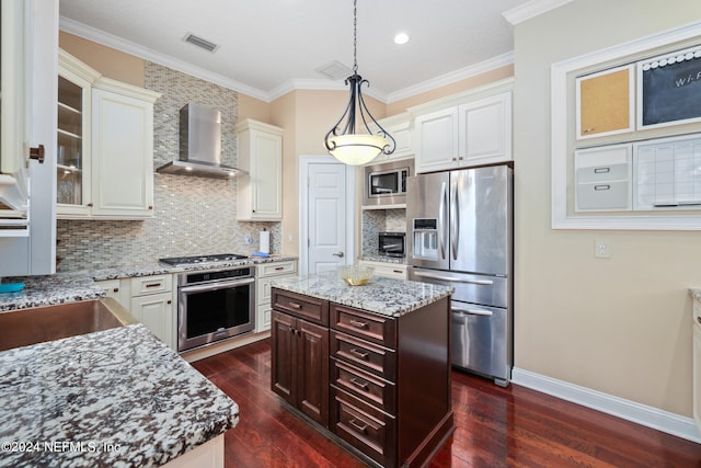 kitchen featuring light stone countertops, wall chimney range hood, stainless steel appliances, and dark hardwood / wood-style flooring