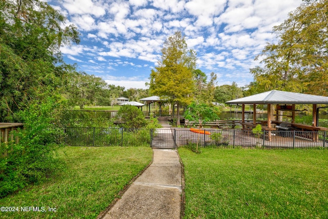 view of property's community featuring a gazebo and a lawn