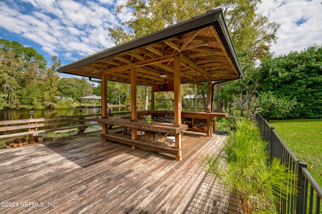 wooden deck featuring a water view