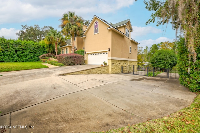 view of side of property featuring a garage