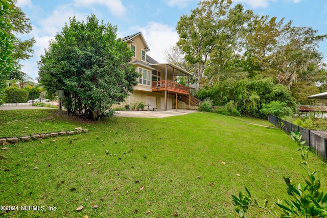 view of yard featuring a patio and a deck