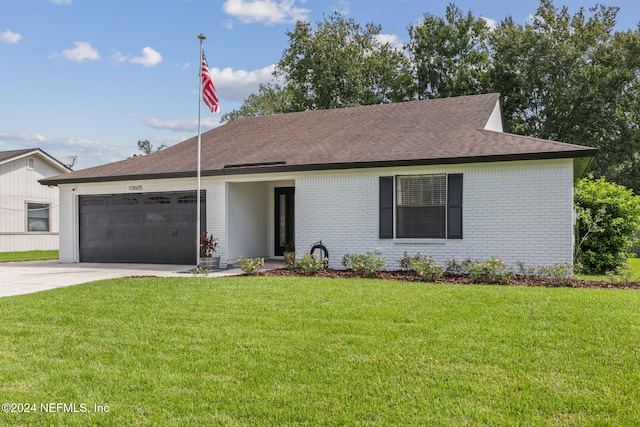 single story home with a front lawn and a garage