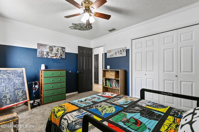 bedroom featuring a closet, ceiling fan, ornamental molding, and light colored carpet