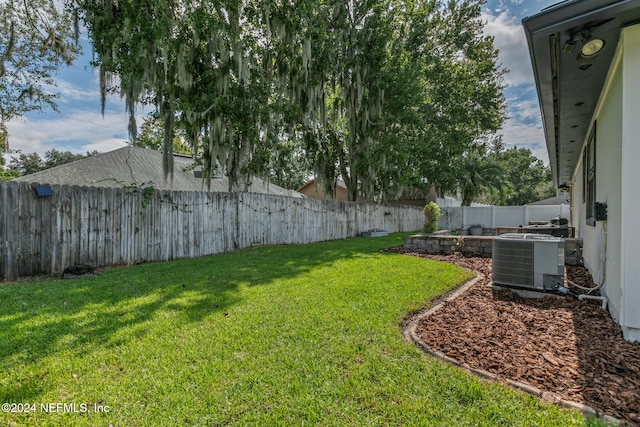 view of yard with central AC unit