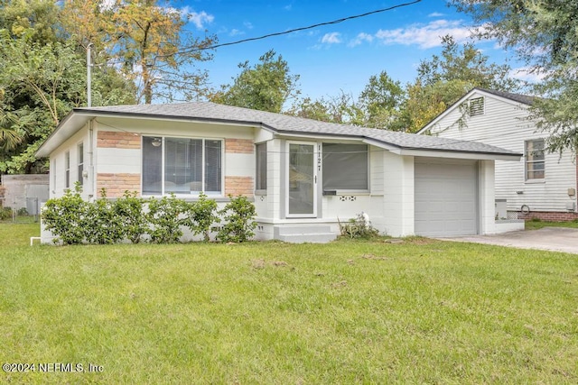 single story home featuring a front yard and a garage