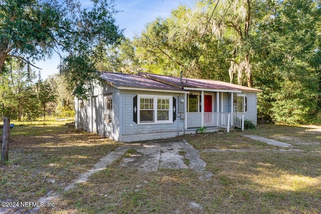 single story home featuring covered porch