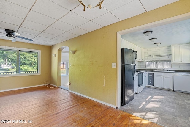 117 Tyre Rd, Palatka, FL 32177 - kitchen featuring white dishwasher, freestanding refrigerator, a sink, arched walkways, and ceiling fan