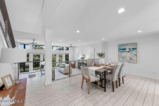 dining space featuring french doors, light hardwood / wood-style floors, and ceiling fan