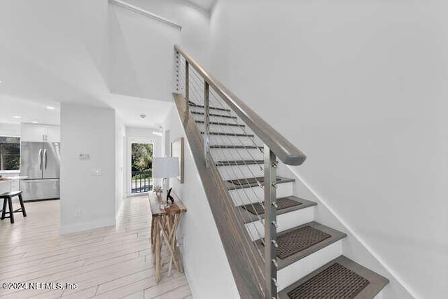 stairway featuring hardwood / wood-style flooring