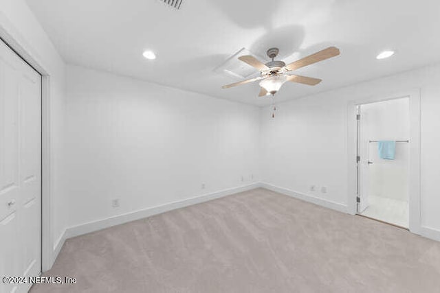 empty room featuring light carpet and ceiling fan