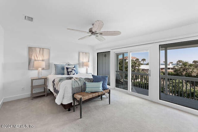 bedroom featuring access to outside, ceiling fan, and carpet