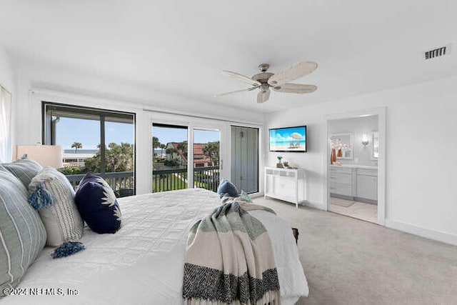 carpeted bedroom featuring ceiling fan, connected bathroom, access to outside, and multiple windows