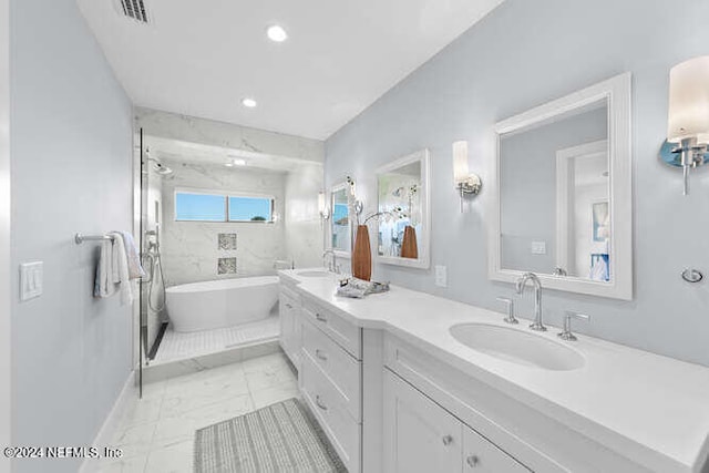 bathroom with a tub to relax in and vanity