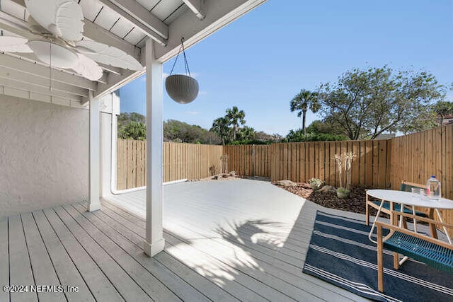 wooden deck with ceiling fan