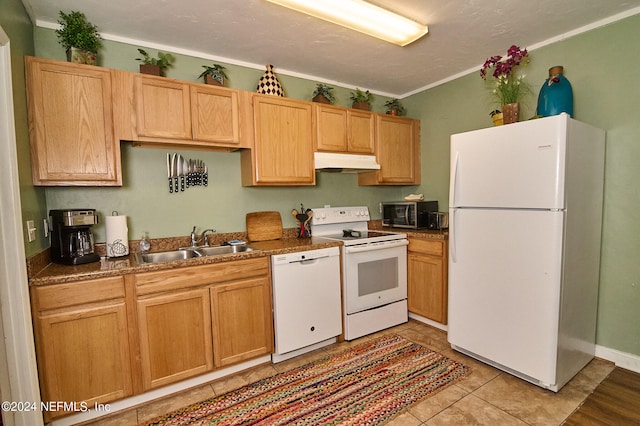 kitchen featuring white appliances, sink, light tile patterned floors, and crown molding