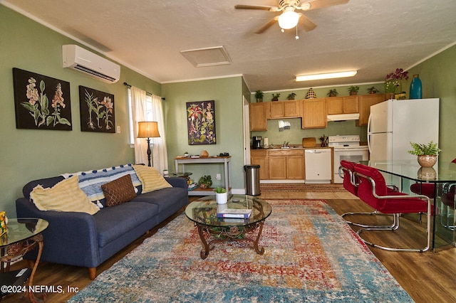 living room featuring sink, ceiling fan, dark hardwood / wood-style floors, a wall mounted AC, and crown molding