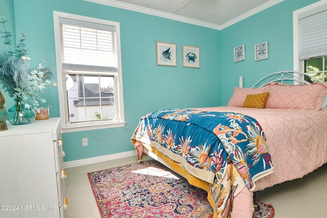 bedroom featuring a textured ceiling, tile patterned floors, and ornamental molding