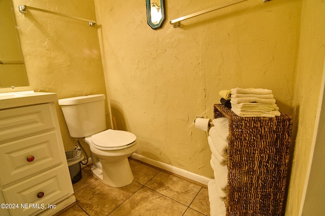 bathroom featuring toilet, vanity, and tile patterned floors